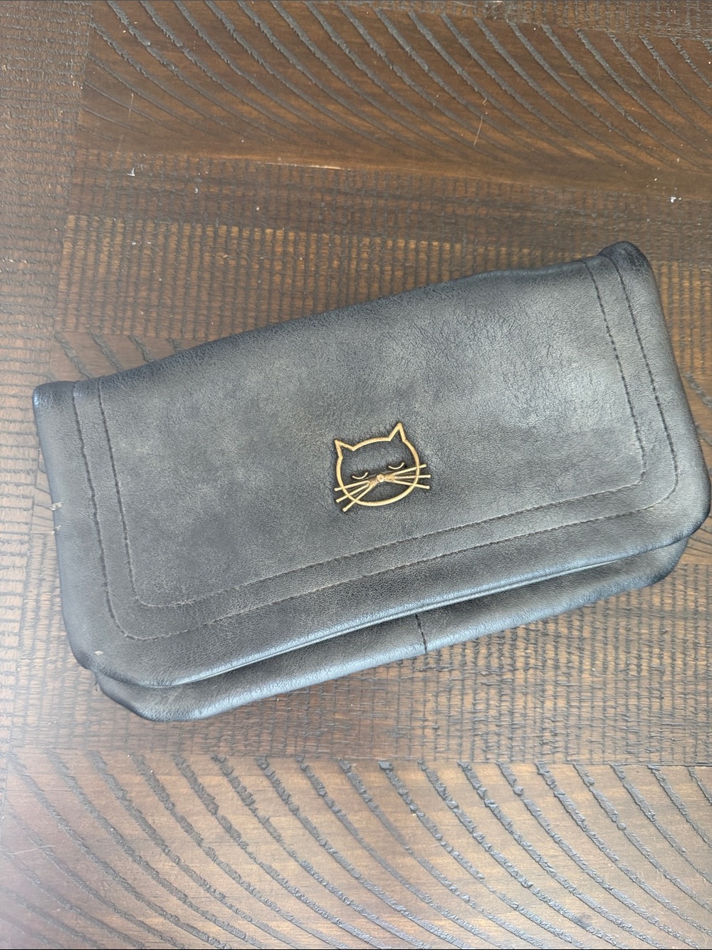 Francesca's Collections Black Clutch with Gold Cat Emblem